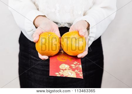 Woman Giving Mandarin Oranges, Red Envelop With Good Luck Character