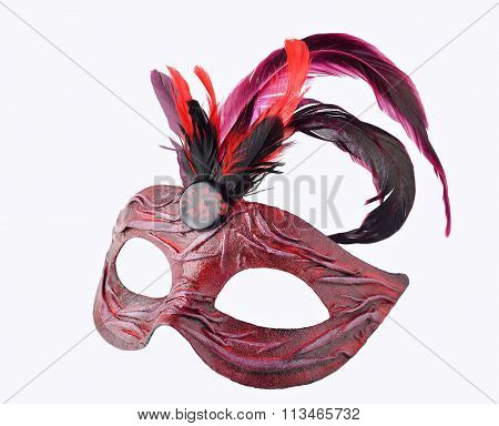 Venetian red Carnival half mask with feathers, isolated on white background