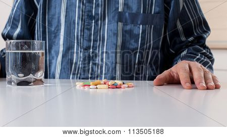 Man Taking Pills