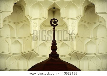 Muqarnas and wooden crescent at Sultan Ismail Airport Mosque