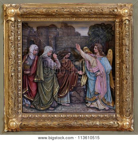STITAR, CROATIA - AUGUST 27: Mary Magdalene and women at the empty tomb of Jesus on day of Resurrection, relief on the baptismal font, church of Saint Matthew in Stitar, Croatia on August 27, 2015