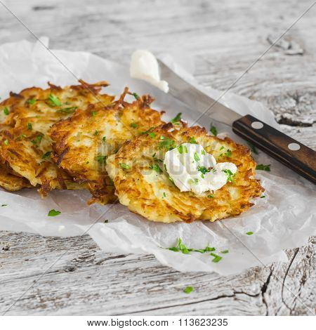 Potato Pancakes Or Latkes On A Light Rustic Wood Surface