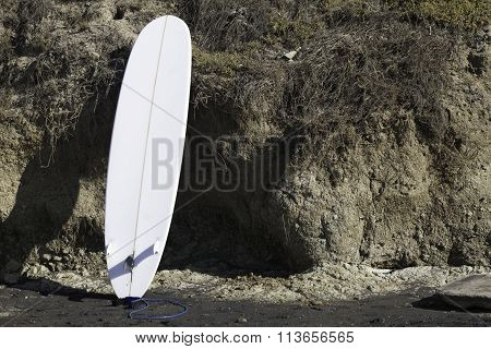Surfboard Leaning On Cliff At Del Mar