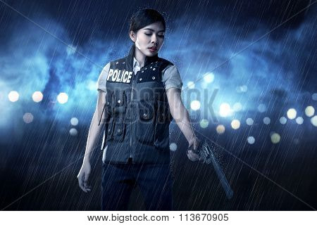 Beautiful Police Woman Holding Gun