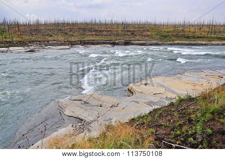 Turbulent Rapids On A Northern River.