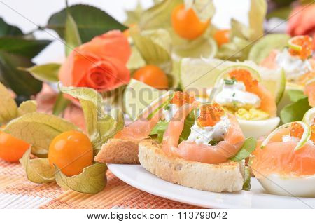 Canapes with salmon and caviar