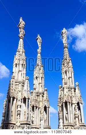 Statues on Milan Cathedral and blue sky