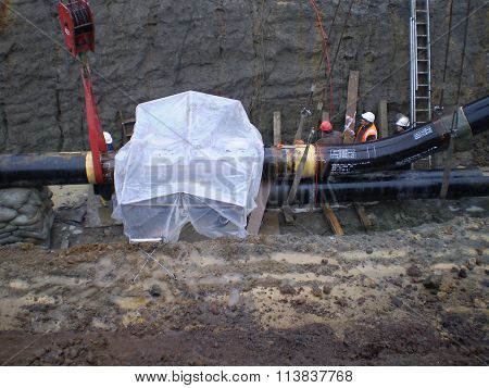 Russia, Sakhalin - 14 November 2014: Laying of the gas pipeline in a ditch. Installation works.