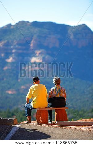 Elderly couple enjoying with beautiful Sedona's red rocks view.