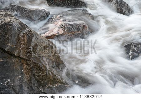 Flowing By The Rocks