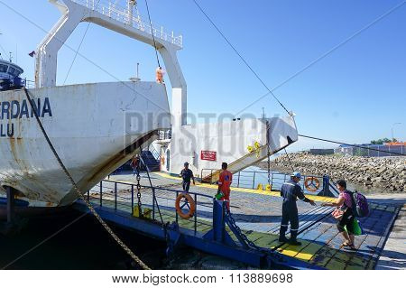 MENUMBOK, SABAH - JAN 6, 2016: Ferry with vehicles on board in the morning,carries passengers.