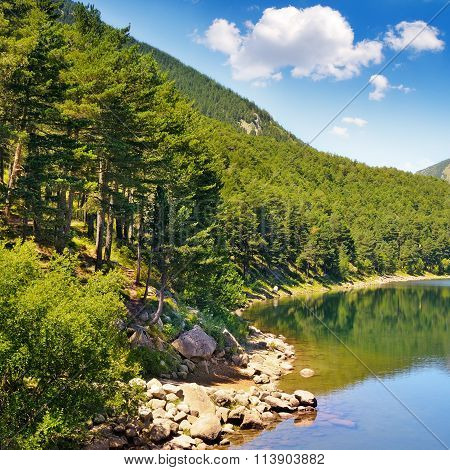 Picturesque Lake, Mountains And Blue Sky