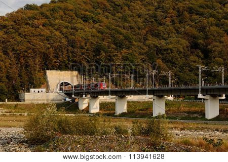 KRASNAYA POLYANA, SOCHI, RUSSIA - SEPTEMBER 30, 2015: High-speed train Lastochka on the mountain railroad. Produced by Siemens AG, the train can reach speeds up to 160 km/h