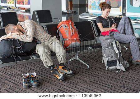 Passengers waiting for the air flight at airport terminal