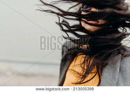Portrait Of Stylish Modern Young Curly Woman In Coat Sunglasses
