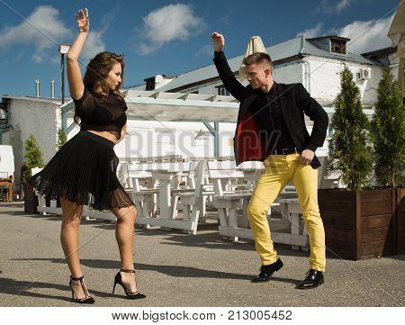 Couple Of Dancers Dancing Bachata On A City Street