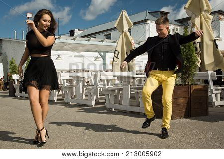 Couple Of Dancers Dancing Bachata On A City Street