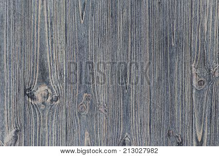 Texture of dark rusty wooden surface. Top view vertical stripes pine planks close up.
