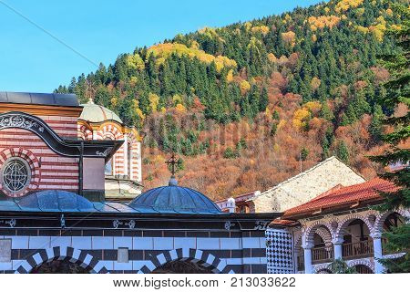 Rila monastery details close-up and autumn mountain trees at background, Bulgaria