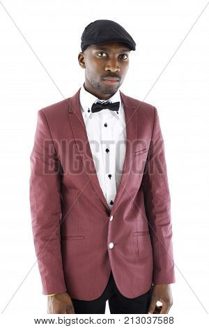 African male dressed in a vintage suit standing with a blank expression