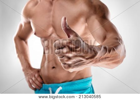 Man Bodybuilder Showing Thumbs Up Gesture