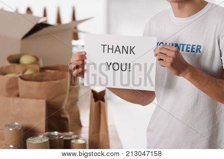 Volunteer With Thank You Placard