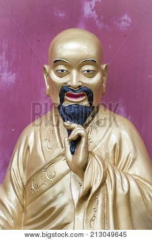SHATIN HONG KONG - SEPT 15 2013 - Golden Buddha figure at the Ten Thousand Buddhas Monastery Hong Kong