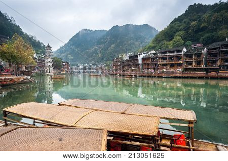 FENGHUANG, CHINA - NOV 11, 2014 - Boats on the Tuojiang River, Fenghuang Ancient Town, China