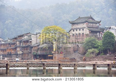 FENGHUANG, CHINA - NOV 12, 2014 - North Gate Tower and Tuojiang River in Fenghuang, Hunan Province, China.