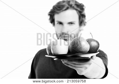 Face Expression Of Strong And Confident Man Offering Apples