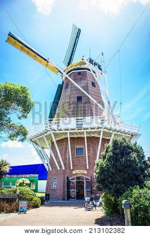 Foxton New Zealand - 28 November 2015: The De Molen Windmill. A Foxton landmark the full size replica of a Dutch windmill called De Molen is a working windmill which makes stone-ground flour which can be purchased inside the mill`s souvenir shop.