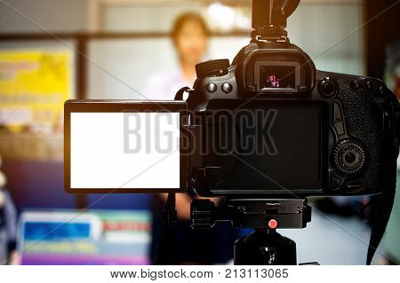 Woman on set Video camera camcorder interviews operator working for record speaker or Presenter in office blak white screen.  