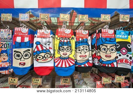 OSAKA, JAPAN - NOV 20, 2016 - Kuidaore Taro souvenirs at Dontonbori, Osaka. Kuidaore Taro is one of the city's most famous mascots.