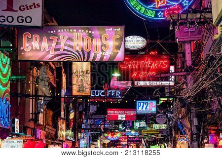 PATTAYA THAILAND - AUGUST 07: Neon signs for bars and clubs in the famous Walking Street red light district on August 07 2017 in Pattaya
