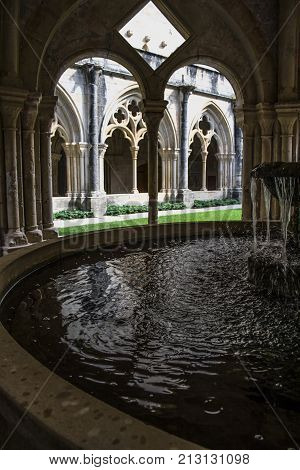 Detail of the cloister of Santa Maria de Poblet Monastery, Unesco heritage. Romanesque cloister architecture in Poblet, Spain.