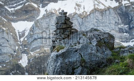 Stones showing route on the Alp mountains in Switzerland