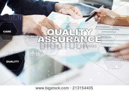 Quality assurance concept on the virtual screen. Business concept.