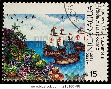 Moscow Russia - November 10 2017: A stamp printed in Nicaragua shows the ships of Christopher Columbus off the coast of America series 