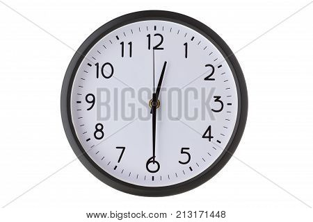 Round office wall clock isolated on white close up half past twelve