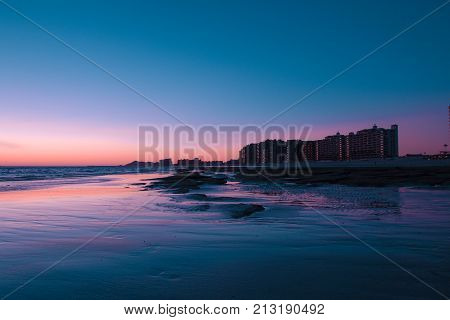 Sunset over a rocky beach in front the hotels at Puerto Penasco (Rocky Point) Mexico.