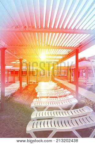 Beautiful sunbeds on the sandy beach of the Black sea photographed in close-up