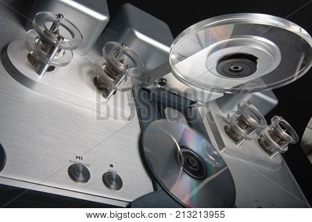 Tube tube CD player isolated on black background