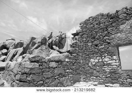Bushiribana Gold Smelter ruins in black and white. North coast, Aruba Island, tourism, historic