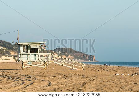 Lifeguard tower near sunset on Zuma Beach in Malibu, California.
