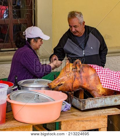Vendor Sells Portion Of Hornado (pig) For Lunch
