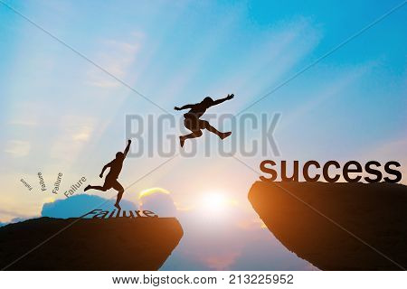Men jump over silhouette failure Committed to success.