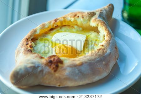 Adjarian Khachapuri With Eggs On The Table