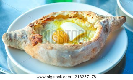 Adjarian Khachapuri With Eggs On The Table