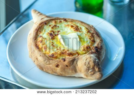 Adjarian Khachapuri With Eggs On The Table