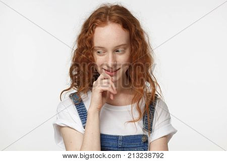 Closeup Headshot Of Young Attractive European Woman With Red Loose Curly Hair Isolated On White Back